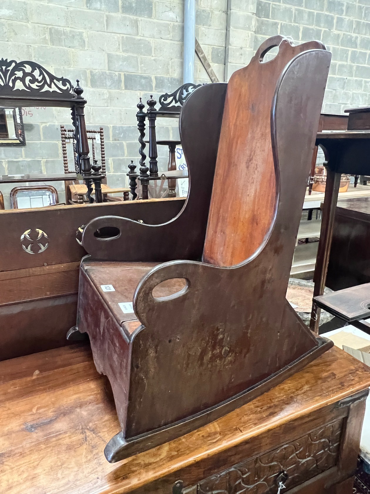 A child's Victorian mahogany wing back commode chair, width 37cm, depth 57cm, height 71cm